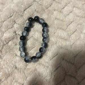 Black and Clear bracelet, stretchy string, will come in a bag. Made by me
